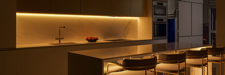 Minimalist and modern kitchen illuminated with warm LED strips