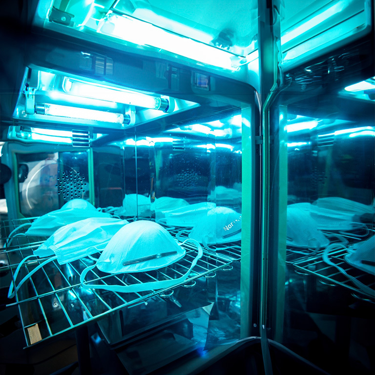 Medical equipment being disinfected with ultraviolet light.