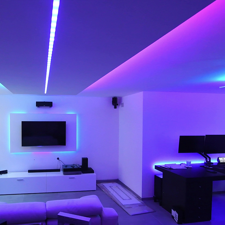 game room with purple and blue rgb led strips lighting design.