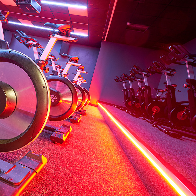 Gym section adapting to user's mood with cool color lighting