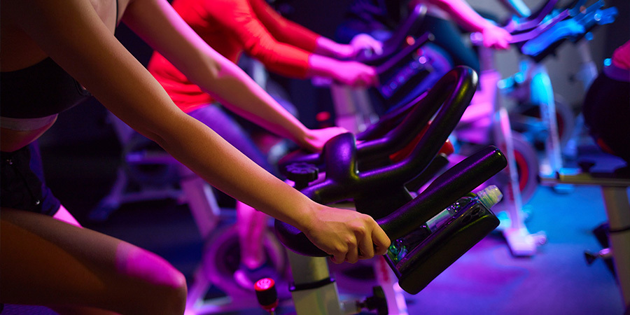 Gym cardio area illuminated with warm RGB lights to go beyond aesthetics