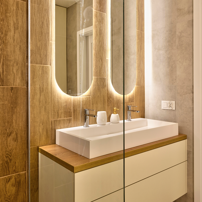 Bathroom vanity with LED-lit mirrors and rectangular double sink