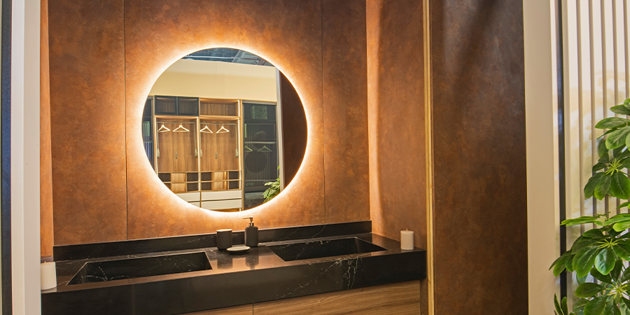 Warm backlighting for a circular mirror over the vanity
