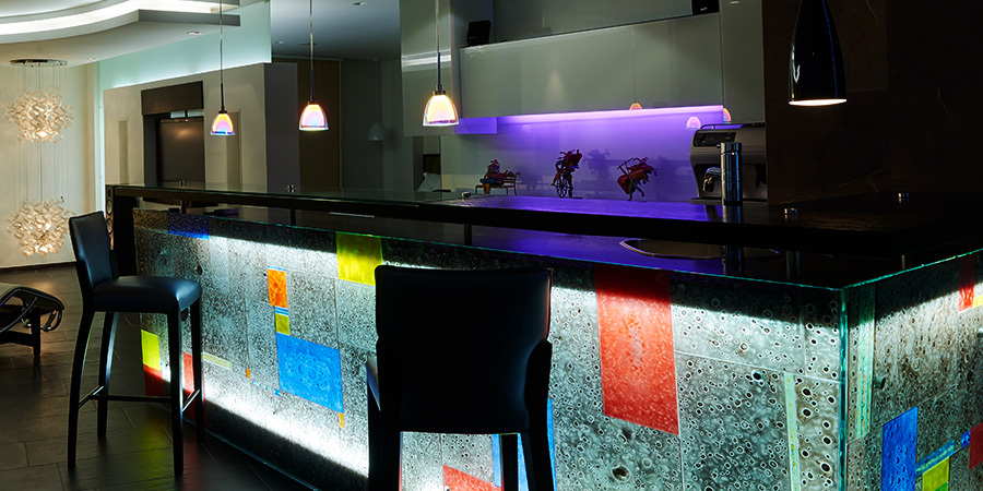 LED lighting illuminating a stylish wet bar